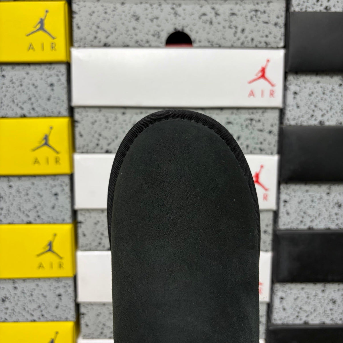 UGG Mini Bailey Bow Ankle Boot – Suede Boot with Tonal Black Shearling Lining, Black Satin Bow & All-Black Lug Sole in Black